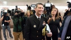 Rear Adm. Ronny Jackson leaves a Senate office building, on Capitol Hill, Washington, April 24, 2018. 