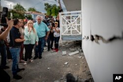 Governor Wanda Vazquez inspect an earthquake-damaged house in Guanica, Puerto Rico, Monday, Jan. 6, 2020. A 5.8-magnitude quake hit Puerto Rico before dawn Monday, unleashing small landslides, causing power outages and severely cracking some homes. …