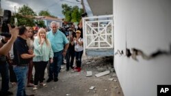 Governor Wanda Vazquez inspect an earthquake-damaged house in Guanica, Puerto Rico, Jan. 6, 2020.