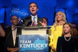 Kentucky Attorney General and democratic Gubernatorial Candidate Andy Beshear stands with his wife, Britainy as he delivers a speech at the Kentucky Democratic Party election night watch party, Nov. 5, 2019, in Louisville, Ky.