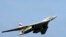 FILE - A TU-160 strategic bomber flies above an airfield near the northern city of Murmansk, Russia, Aug. 16, 2005. 