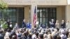 Former president George W. Bush waves three fingers, signifying his place in U.S. history as the 43rd president during the dedication of the George W. Bush Presidential Center, Dallas, Texas, April 25, 2013. (VOA/Brian Allen)