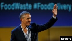 Former U.S. President Barack Obama waves after speaking at the Global Food Innovation Summit in Milan, Italy, May 9, 2017. 