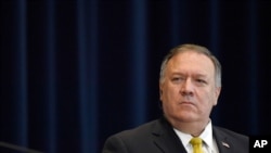 Secretary of State Mike Pompeo listens during a news conference at the State Department in Washington, Wednesday, Aug. 19, 2020, with Iraqi Foreign Minister Fuad Hussein. (AP Photo/Susan Walsh)