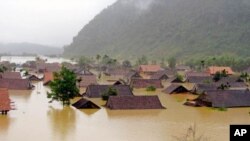 Homes are inundated in Vietnam's Tan Hoa commune, in the central province of Quang Binh, October 2, 2011. Vietnam is also facing serious flooding in its southern Mekong Delta region where thousands of houses and thousands of hectares of rice fields are i