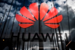 In this file photo taken on Nov. 6, 2019, the logo of Chinese telecom giant Huawei is pictured during the Web Summit in Lisbon.