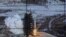 TV image of Pyonyang's Unha-3 rocket lifting off from Tongchang-ri launch site, North Korea, Dec. 12, 2012.