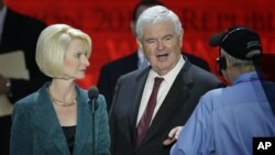 Former House Speaker Newt Gingrich and his wife Callista look over the podium during a sound check at the Republican National Convention in Tampa, Florida, August 28, 2012.