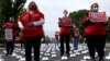 Enfermeras del sindicato National Nurses United (NNU) protestan frente a la Casa Blanca, el 12 de mayo de 2021 por las condiciones de trabajo en honor a las más de 400 enfermeras que han muerto de COVID-19 desde el inicio de la pandemia en EE. UU.