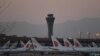 Air China planes are seen on the tarmac at Beijing Capital Airport in Beijing amid the ongoing COVID-19 coronavirus outbreak on March 13, 2020. - China reported just eight cases of the coronavirus on March 13, with no new domestic infections outside the e