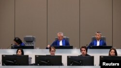 FILE - Judges are seen in the courtroom for the trial of the Congolese militia commander Bosco Ntaganda at the ICC (International Criminal Court) during his trial at the Hague, in the Netherlands, July 8, 2019. 