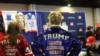 People wear merchandise in support of US President Donald Trump at a vendor booth during the annual Conservative Political Action Conference at the Gaylord National Resort & Convention Center at National Harbor in Oxon Hill, Maryland, on Feb. 21, 2025.