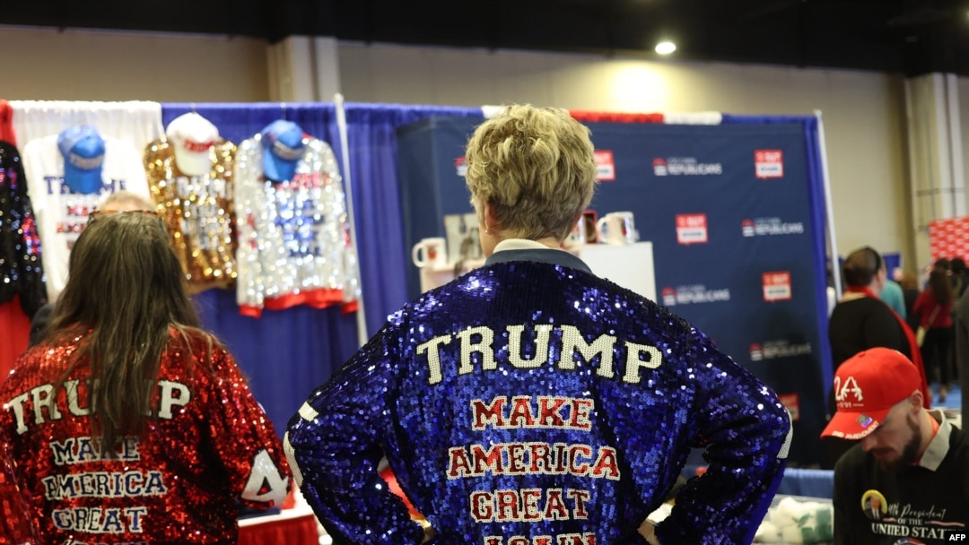 People wear merchandise in support of U.S. President Donald Trump at a vendor booth during the annual Conservative Political Action Conference at the Gaylord National Resort & Convention Center at National Harbor in Oxon Hill, Maryland, on Feb. 21, 2025.