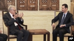 In this photo released by the Syrian official news agency SANA, Syrian President Bashar Assad, right, meets with the U.N.-Arab League envoy Lakhdar Brahimi, in Damascus, September 15, 2012. 