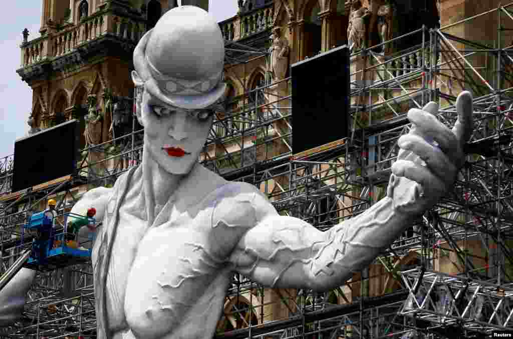 Workers set-= up the stage for the 24th Life Ball in front of the city hall in Vienna, Austria.