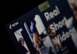 FILE - The logo of the TikTok application is seen on a screen in this picture illustration taken Feb. 21, 2019.