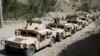 An Afghan commando forces armored convoy leaves toward the front line, at Ghorband district, Parwan province, Afghanistan, June 29, 2021. 
