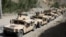 An Afghan commando forces armored convoy leaves toward the front line, at Ghorband district, Parwan province, Afghanistan, June 29, 2021. 