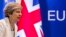 FILE - British Prime Minister Theresa May prepares to address a press conference at an EU summit in Brussels, June 23, 2017.