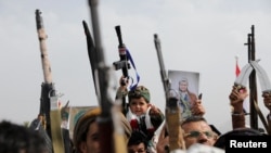 A child holds a toy gun at a Houthi rally supporting Palestinians in the Gaza Strip, in Sanaa, Yemen, on Aug. 30, 2024. The Houthi rebels are suspected of firing two missiles at a container ship in the Gulf of Aden on Aug. 30.