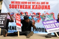 FILE - People gather to protest the incessant killings in southern Kaduna and insecurities in Nigeria, at the U.S. Embassy in Abuja, Nigeria, Aug. 15, 2020.