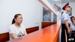 FILE - A picture taken on July 13, 2018 shows Sayragul Sauytbay, an ethnic Kazakh Chinese national and former employee of the Chinese state, who is accused of illegally crossing the border to join her family in Kazakhstan, inside a defendants' cage during
