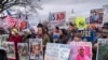 FILE - Demonstrators rally against the Trump administration as it dismantles the U.S. Agency for International Development, which administers foreign aid approved by Congress, on Capitol Hill in Washington, Feb. 5, 2025.