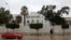 FILE - A car drives past the Italian embassy in Tripoli, Libya, Jan. 10, 2017. 