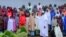 FILE - Nigeria's President Muhammadu Buhari meets with some of the newly released Dapchi schoolgirls in Abuja, Nigeria, March 23, 2018.