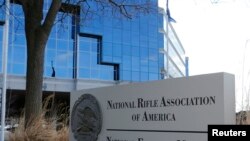 FILE - A sign of the National Rifle Association is seen in front of their headquarters in Fairfax, Virginia, March 14, 2013. 