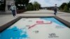 Visitors walk by a map of two Koreas showing North Korea's capital Pyongyang and South Korea's capital Seoul at the Imjingak Pavilion in Paju, near the border with North Korea, South Korea, Sept. 24, 2021.