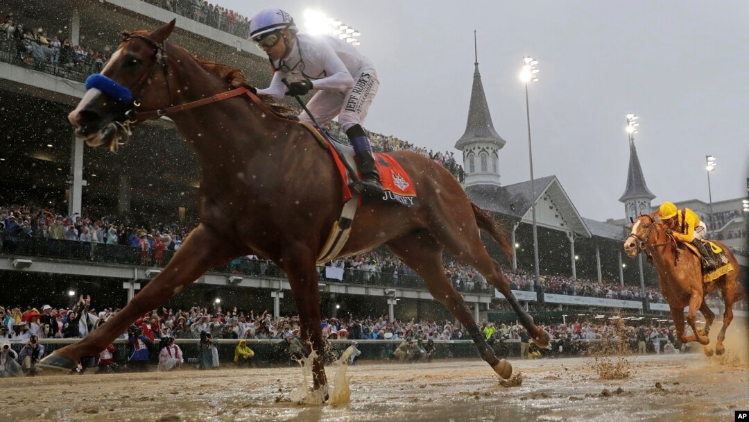 Mike Smith rides Justify to victory during the 144th running of the Kentucky Derby horse race at Churchill Downs, May 5, 2018, in Louisville, Ky. 