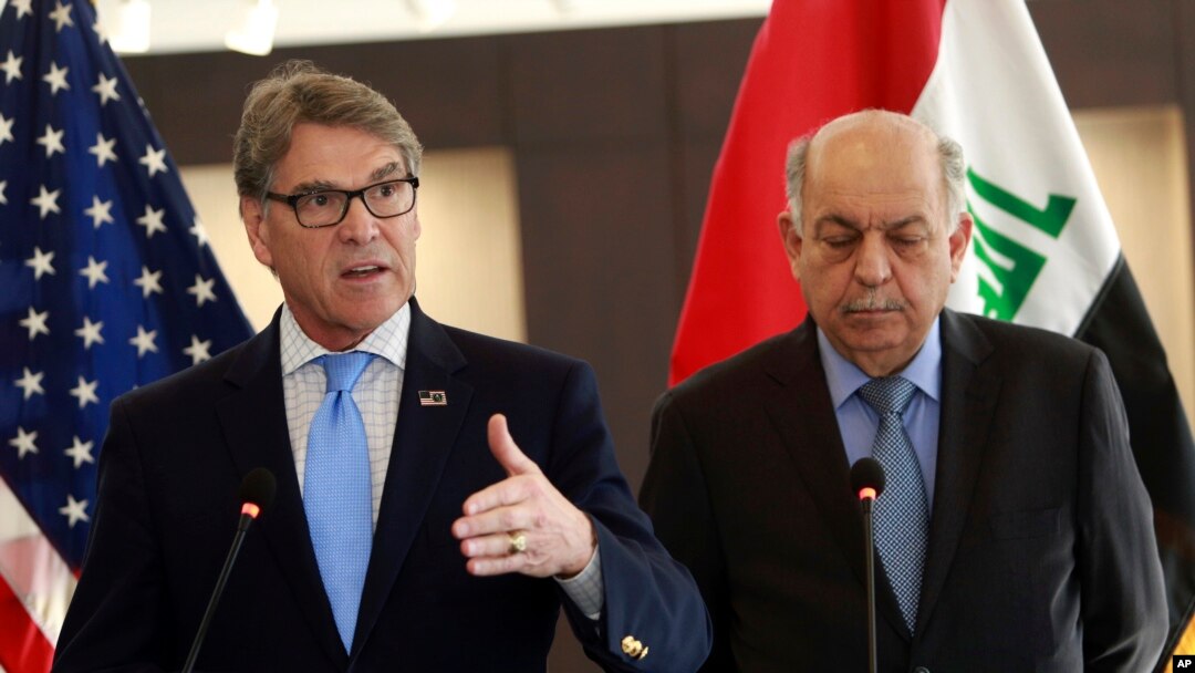 U.S. Energy Secretary Rick Perry, left, with Iraqi oil minister, Thamir Ghadhban during a U.S. chamber of commerce's U.S. Iraq business initiative mission to Iraq, in Baghdad, Dec. 11, 2018. 