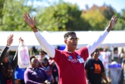 FILE - Rafer Johnson joins thousands at Piedmont Park to support the fight against HIV/AIDS at the 28th annual Atlanta AIDS Walk &amp; 5K Run, Oct. 21, 2018, in Atlanta.