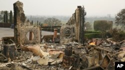 The remains of the Signorello Estate winery continue to smolder in Napa, Calif., Oct. 10, 2017.