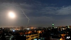 FILE - This SANA photo shows missiles near Damascus' airport, Jan. 21, 2019. Syrian air defenses targeted projectiles fired from Israel's direction May 17-18, 2019, Syria said. Israel did not comment but has said before that it was attacking Iranian military targets in Syria.