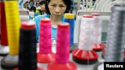 A woman works at Maxport garment company in Hanoi, Vietnam, May 15, 2019.