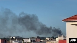 This video grab taken from an AFPTV video on Sept. 17, 2024, shows a plume of smoke rising in Bamako, Mali, as shots and detonations were heard during a jihadist attack on a military airport and training center.