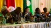 Zimbabwe Electoral Commission Chairwoman Qhubani Moyo, center, announces the results of the presidential election in Harare, Zimbabwe, Aug. 3, 2018. Emmerson Mnangagwa of the ZANU-PF party was declared winner in the first vote since the fall of longtime l