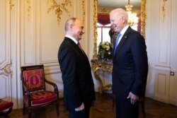 Russian president Vladimir Putin, left, talks with US president Joe Biden, right, during the US - Russia summit in Geneva, Switzerland, June 16, 2021.