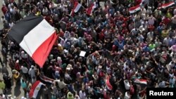 Protesters demonstrate at Tahrir Square in Cairo, Egypt, a day after a court sentenced deposed president Hosni Mubarak to life in prison, June 3, 2012.