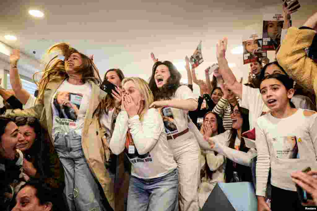 Family members and supporters of Israeli hostage Agam Berger, a soldier who was seized from her army base in southern Israel during the deadly October 7, 2023 attack by Hamas, react as they watch a broadcast of Berger during her release, in Holon, Israel.