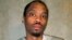 FILE - This photo provided by the Oklahoma Department of Corrections shows Julius Jones Feb. 5, 2018.