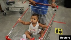 A baby is seen in a store after the government eased some protective measures following the coronavirus disease (COVID-19) outbreak, in Bangkok, Thailand on June 19, 2020. (REUTERS/Jorge Silva/File Photo)