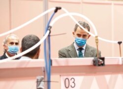 Spain's King Felipe VI visits a military hospital set up at the IFEMA conference center in Madrid, March 26, 2020.