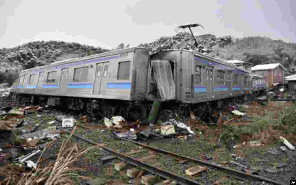 A damaged train is seen after an earthquake and tsunami in Matsushima City, Miyagi Prefecture March 12, 2011.