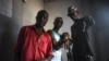 South Sudanese rapper Lual D'awol poses with fellow hip-hop artists in a recording studio in Juba, June 4, 2016. (J. Patinkin/VOA)