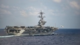 FILE PHOTO: An F/A-18F Super Hornet launches from the flight deck of the U.S. Navy aircraft carrier USS Theodore Roosevelt in the Philippine Sea