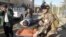 A wounded man is transported on a stretcher to receive treatment after a suicide bomb blast attack in Kirkuk, 250 km (155 miles) north of Baghdad, January 16, 2013.