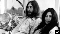 John Lennon and Yoko Ono held two week-long Bed-Ins for Peace in Amsterdam and Montreal to protest the US war in Vietnam. Here the couple is pictured at the Hilton Hotel in Amsterdam on March 25, 1969.